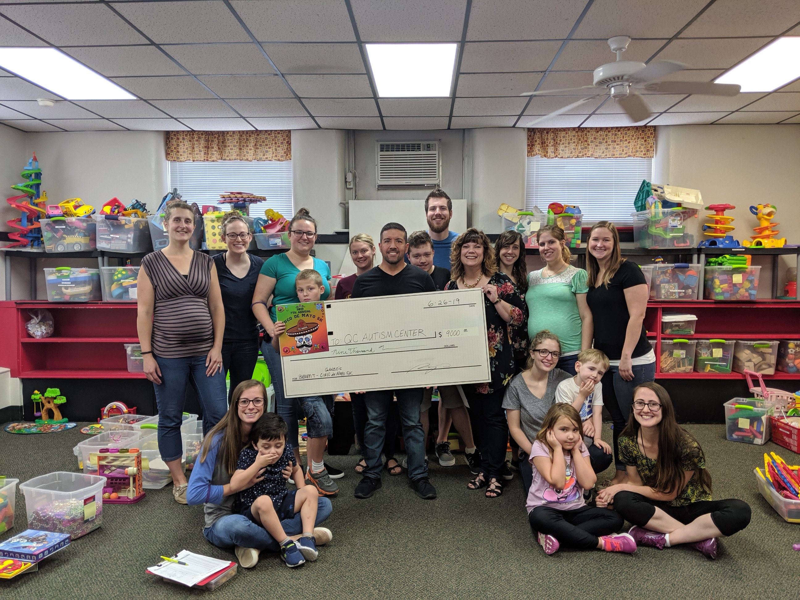 2019 Cinco de Mayo 5K donation of $9,000.00 to the Quad Cities Autism Center